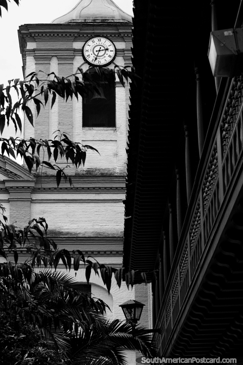 Bell and clock tower, wooden balcony, historic building in Bogota, black and white. (480x720px). Colombia, South America.