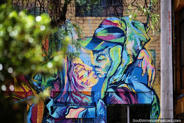 Man and woman kissing, street mural in a multitude and rainbow of colors in Bogota. (720x480px). Colombia, South America.