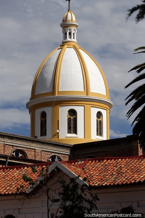 Large yellow and white dome of San Miguel Arcangel Church in Paipa. (480x720px). Colombia, South America.