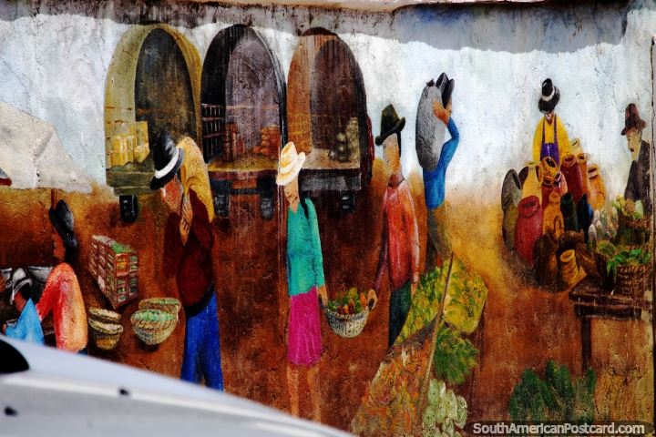 Comunidade a trabalhar com os seus produtos, um mural pintado com tons de cores agradáveis, Pueblito Boyacense, Duitama. (720x480px). Colômbia, América do Sul.