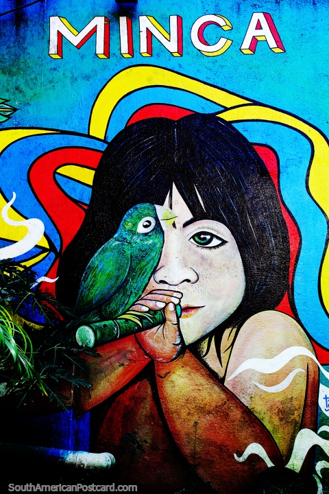 Menino indígena com um papagaio sentado em uma flauta de madeira, belo mural em Minca. (480x720px). Colômbia, América do Sul.
