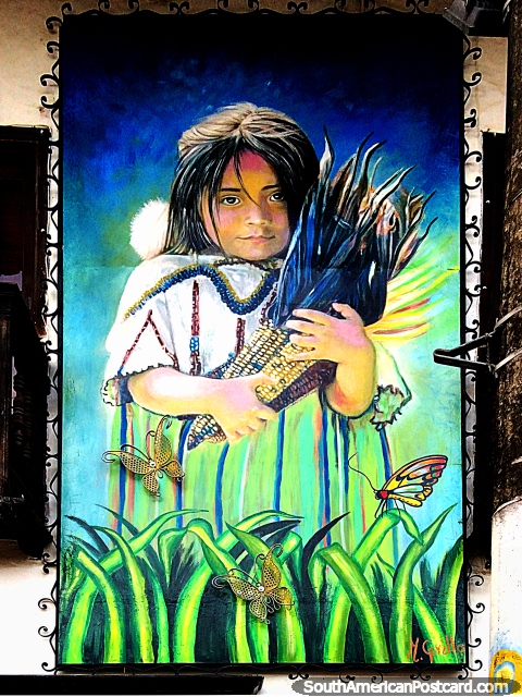 Jovem segura espigas de milho em um campo de borboletas, grande mural de rua em San Agustin. (480x640px). Colômbia, América do Sul.
