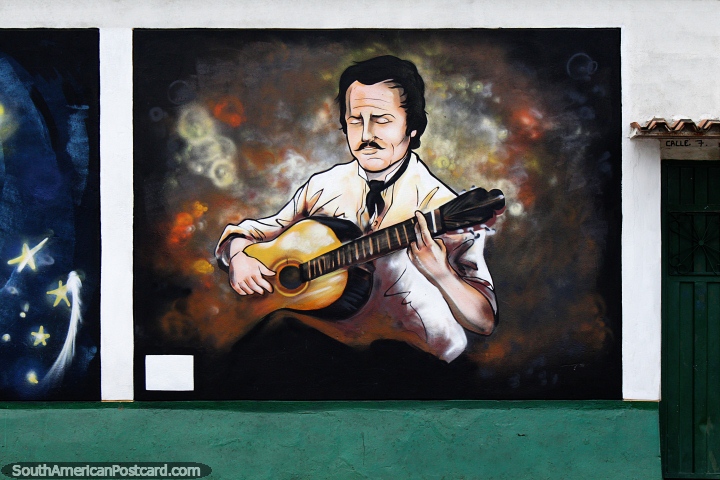 Homem toca violão clássico, mural de rua em Villa del Rosario, Cucuta. (720x480px). Colômbia, América do Sul.