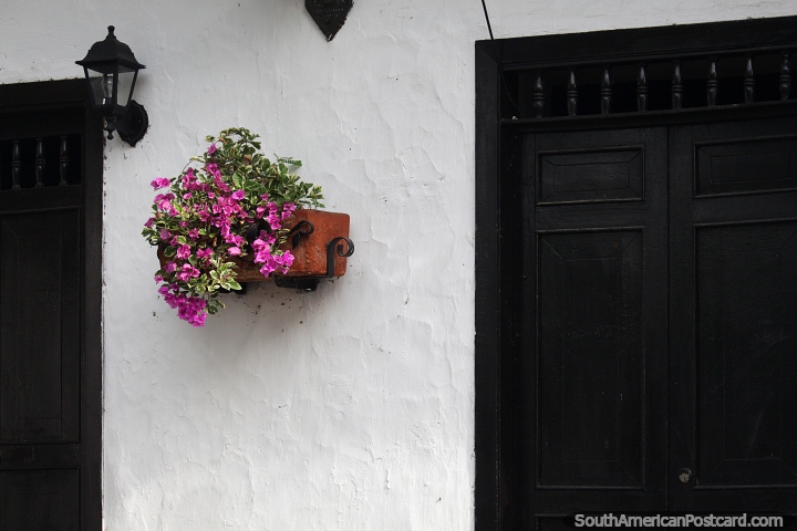 Giron, a place with nice facades, lamps and flower pots outside the houses. (720x480px). Colombia, South America.