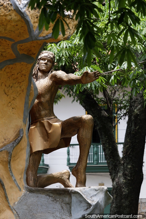 Gold monument of an indigenous warrior at the plaza in San Gil. (480x720px). Colombia, South America.