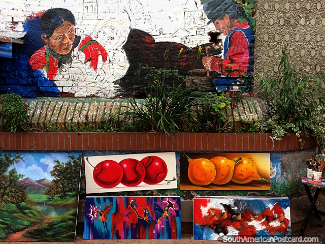 Pinturas a la venta en la calle con un mural de indgenas arriba en Pasto. (640x480px). Colombia, Sudamerica.