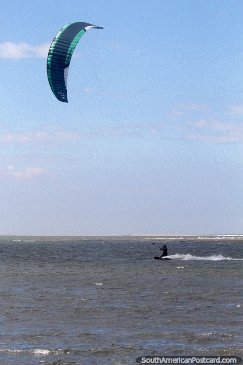 Kite-surfing in high winds at Morro beach in Tumaco, great fun. (480x720px). Colombia, South America.