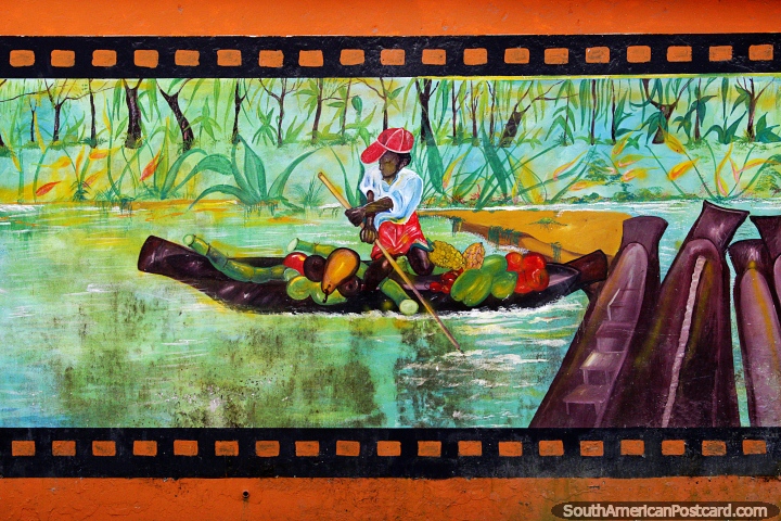 Homem carrega frutas frescas em sua canoa no rio, mural de rua em Quibdo. (720x480px). Colmbia, Amrica do Sul.