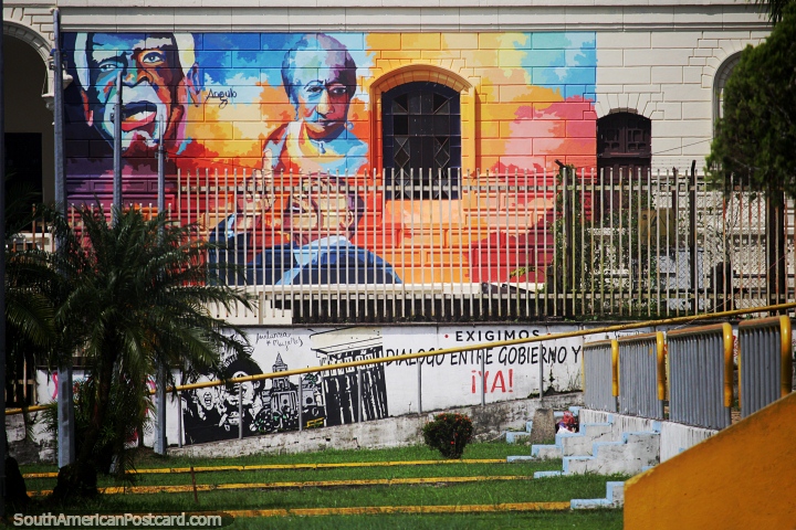 Rainbow colored mural of 3 important people on a building-side in Quibdo. (720x480px). Colombia, South America.