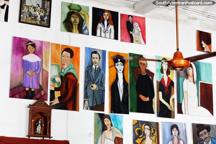 A popular restaurant in Santa Fe de Antioquia with many portraits exhibited on the walls. (720x480px). Colombia, South America.