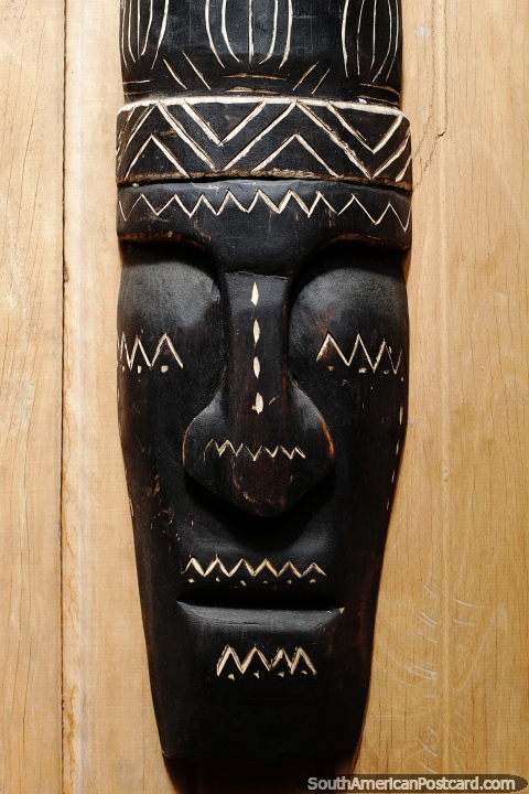Black and white mask, long face with painted designs, museum in Mocagua, Leticia. (480x720px). Colombia, South America.