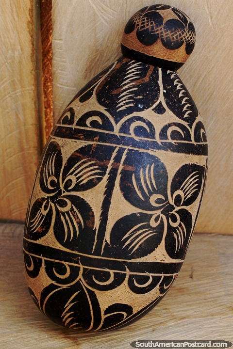 Ceramic work with a painted black flower design, Mocagua museum near Leticia. (480x720px). Colombia, South America.