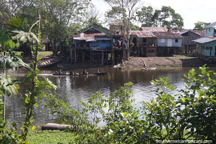 Community of houses on stilts built close together beside the river in Leticia. (720x480px). Colombia, South America.
