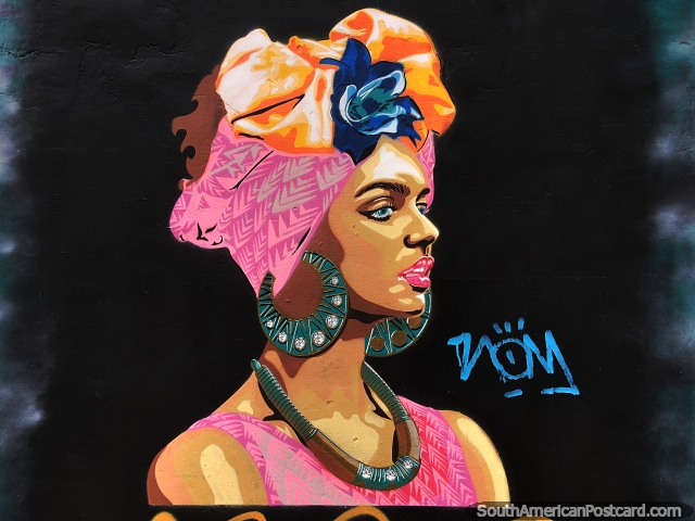 Street painting of a woman with a necklace, large earrings and head wear in Bogota. (640x480px). Colombia, South America.