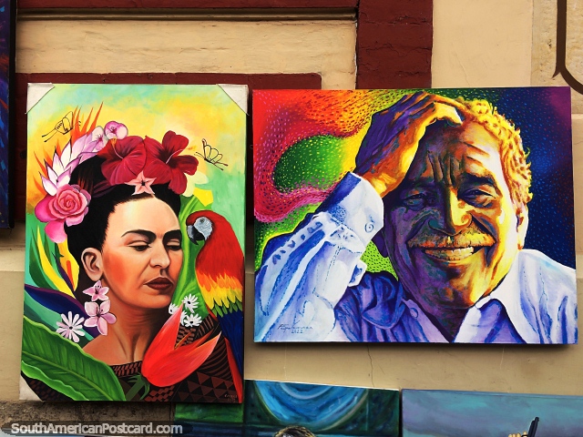 Man smiling and a woman with a macaw, paintings for sale in Bogota. (640x480px). Colombia, South America.