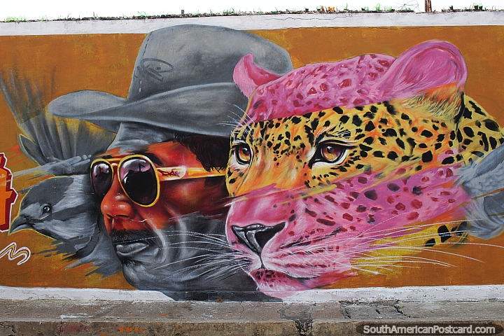 Jaguar with a man and bird, street art in Riohacha. (720x480px). Colombia, South America.