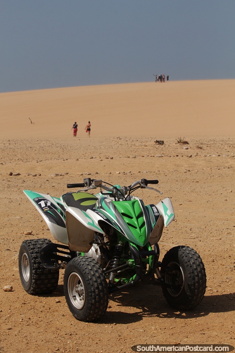 Rent a dune buggy to enjoy the sand dunes in Taroa. (480x720px). Colombia, South America.