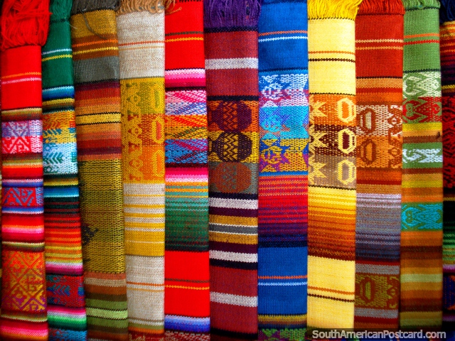 Colorful shawls displayed at market, Otavalo. (640x480px). Ecuador, South America.