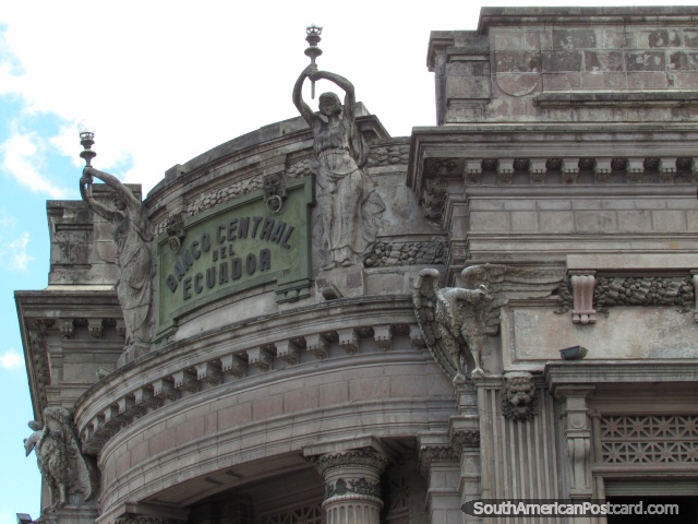 Bank with figures holding lanterns made from stone, Quito. (640x480px). Ecuador, South America.