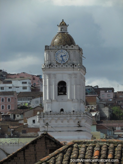 Church with bell and clock-tower and green dome in Quito. (480x640px). Ecuador, South America.