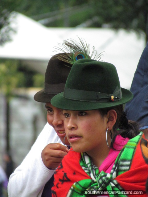 Women of Quito wearing hats with peacock feather. (480x640px). Ecuador, South America.
