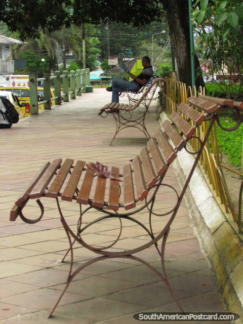 Park benches at a park in Tena. (480x640px). Ecuador, South America.
