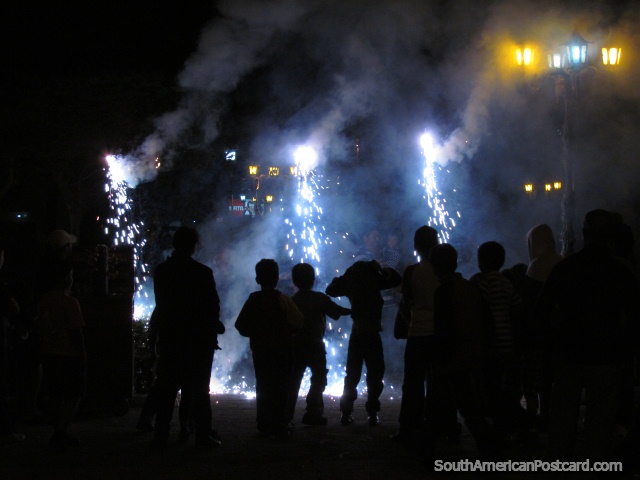 The locals of Vilcabamba enjoy the festival fireworks. (640x480px). Ecuador, South America.