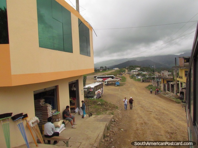 Bus terminal, shop and dirt street in Zumba. (640x480px). Ecuador, South America.
