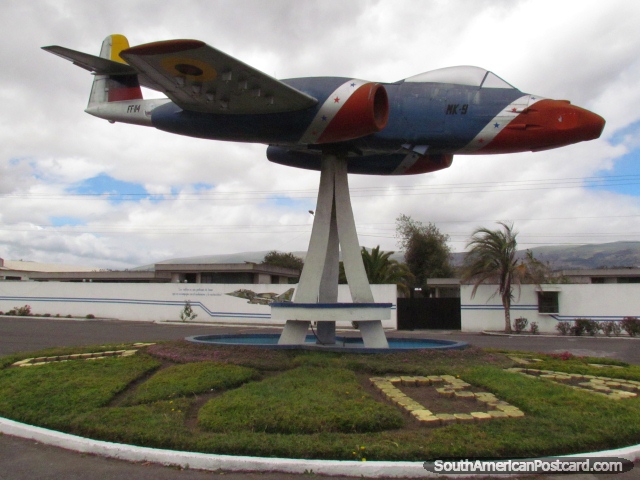Red, blue and yellow fighter plane monument at Cotopaxi Air Base in Latacunga. (640x480px). Ecuador, South America.