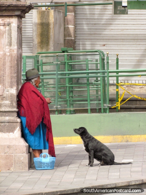 Indigenous woman and black dog, Quito. (480x640px). Ecuador, South America.