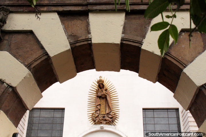 An archway and a gold figure at the cathedral beside Parque Juan Montalvo in Ambato. (720x480px). Ecuador, South America.
