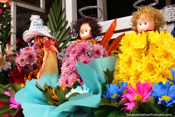 Flower dolls of yellow and purple for sale in Ambato. (720x480px). Ecuador, South America.