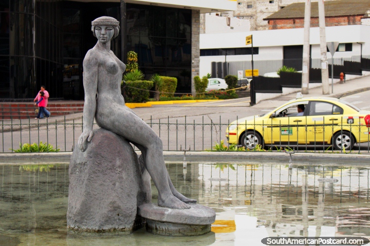 A female statue figure sitting on a rock in water in Ambato. (720x480px). Ecuador, South America.