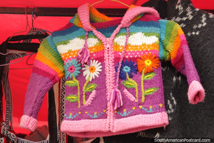 A childs cardigan with flowers and colors for sale at Plaza Roja in Riobamba. (720x480px). Ecuador, South America.