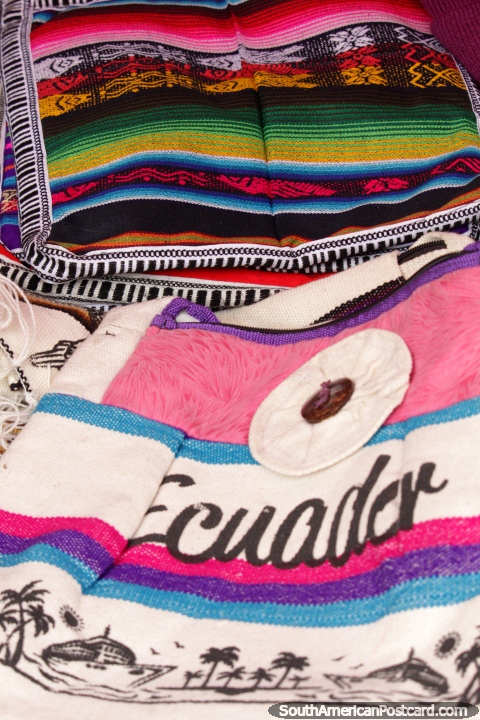 The colors of Ecuador, cloths, bags and more for sale at Plaza Roja, Riobamba. (480x720px). Ecuador, South America.