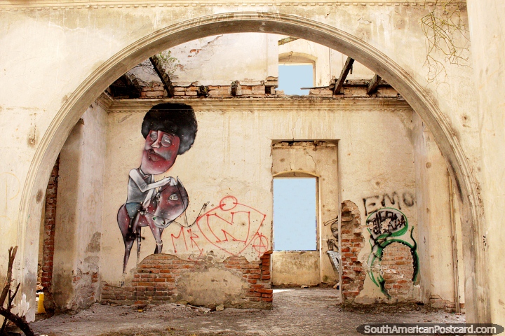 An archway and graffiti art in an abandoned castle on the hill in Alausi. (720x480px). Ecuador, South America.