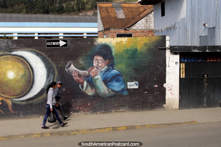 Man in a hat blows a cow horn, wall mural in Biblian. (720x480px). Ecuador, South America.