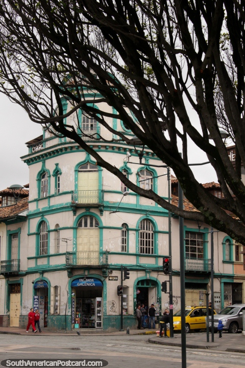 An old historic green building on the corner of Parque Mara Auxiliadora in Cuenca. (480x720px). Ecuador, South America.