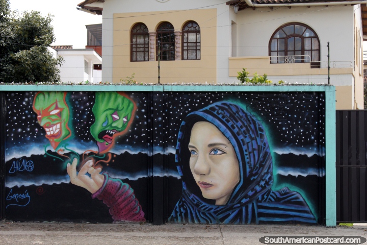 A woman holds 2 green ghosts in her hand, mural near the stadium in Cuenca. (720x480px). Ecuador, South America.