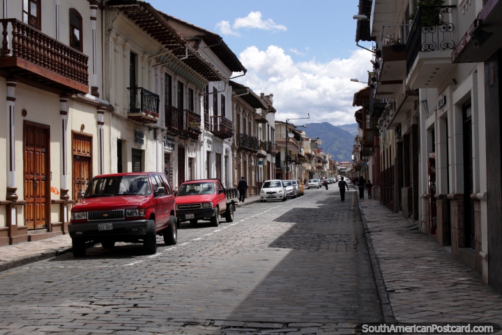 Cobblestone street and footpath and nice building facades in Cuenca. (720x480px). Ecuador, South America.