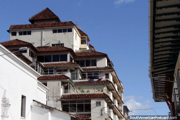 An apartment building with an interesting style that blends into the Cuenca city-scape. (720x480px). Ecuador, South America.