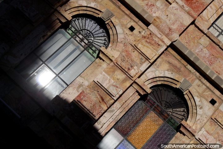 Stone marble facade with arched windows in central Cuenca. (720x480px). Ecuador, South America.