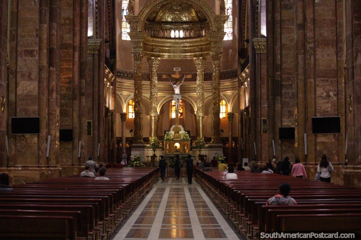 The golden altar and stone surroundings of the Cuenca cathedral. (720x480px). Ecuador, South America.
