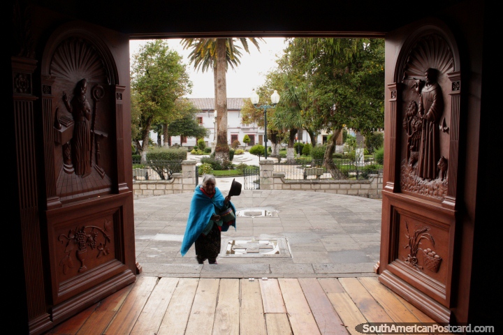 An elderly Quechua woman pays her respect to God at the church in Pujili. (720x480px). Ecuador, South America.