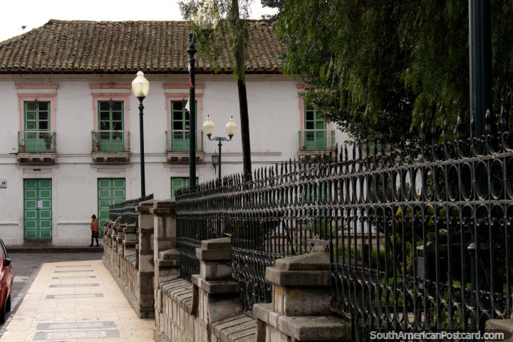 An old building, lamps and fence around the plaza in Pujili. (720x480px). Ecuador, South America.