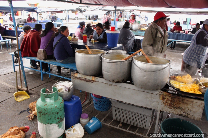 People eating breakfast at the Pujili Central Market. (720x480px). Ecuador, South America.