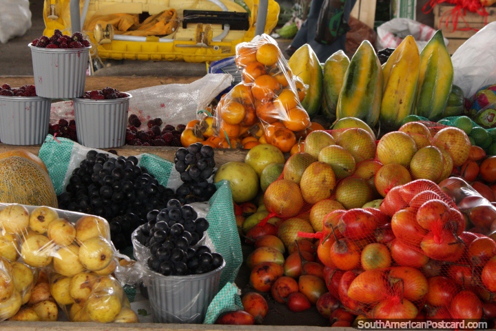 Tamarillos, maracuja, papaya and grapes for sale at Plaza Gran Colombia, Saquisili. (720x480px). Ecuador, South America.