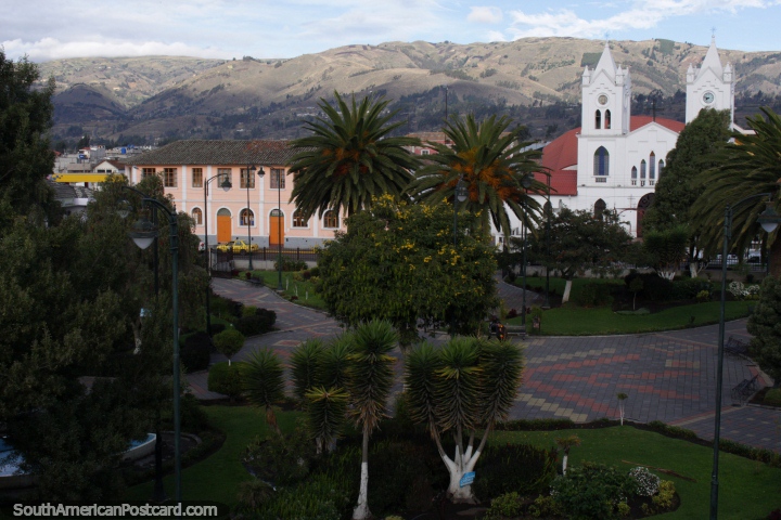 The central plaza and park in Saquisili with views of the church and surrounding hills. (720x480px). Ecuador, South America.