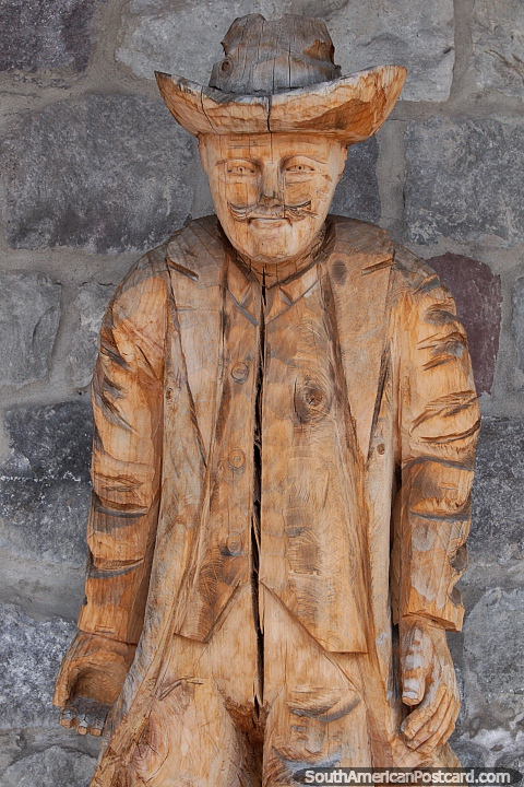 Man in a cowboy hat, sculpture made of wood in Ibarra. (480x720px). Ecuador, South America.