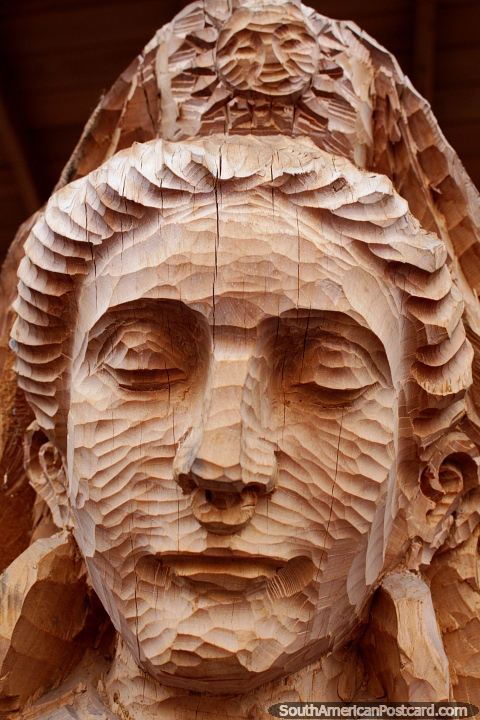 Details in the face of a woman carved in wood, the San Antonio tradition, Ibarra. (480x720px). Ecuador, South America.